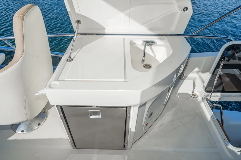 Slide: The Image of Luxury yacht Absolute 45 FLY 2019, featuring sleek outdoor kitchenette design. - 31