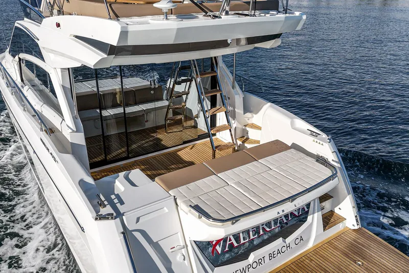 Slide: The Image of Luxury Absolute 45 FLY yacht cruising, 2019 model, featuring spacious deck and elegant design. - 34