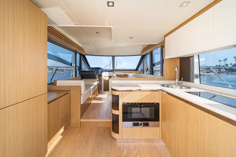 Slide: The Image of Luxurious interior of 2019 Absolute 45 FLY yacht with modern kitchen and panoramic windows. - 36