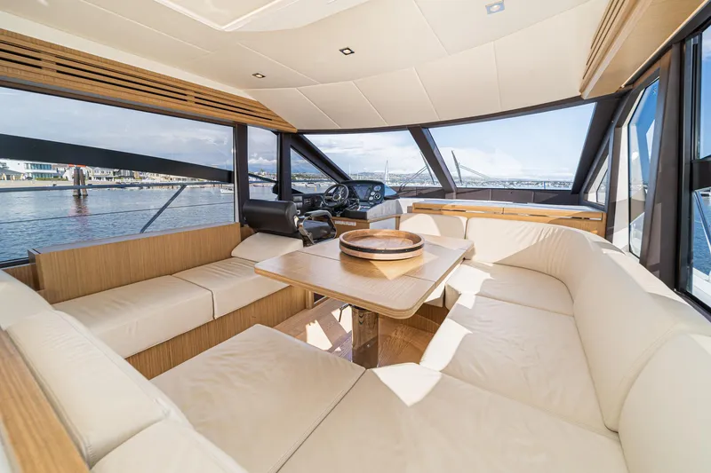 Slide: The Image of Luxurious interior of 2019 Absolute 45 FLY yacht with elegant seating and panoramic windows. - 41