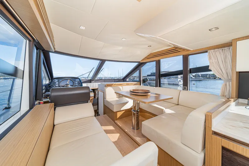 Slide: The Image of Luxurious interior of 2019 Absolute 45 FLY yacht with elegant seating and panoramic windows. - 42