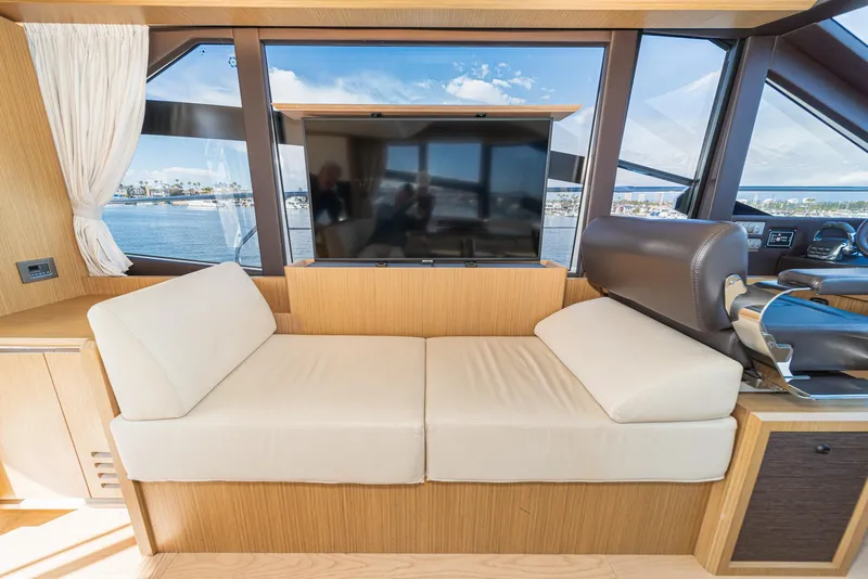Slide: The Image of Interior of 2019 Absolute 45 FLY yacht with beige seating and large windows. - 43