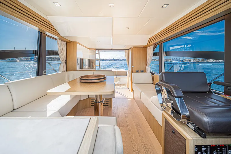 Slide: The Image of Luxurious interior of 2019 Absolute 45 FLY yacht with panoramic windows and elegant seating. - 44