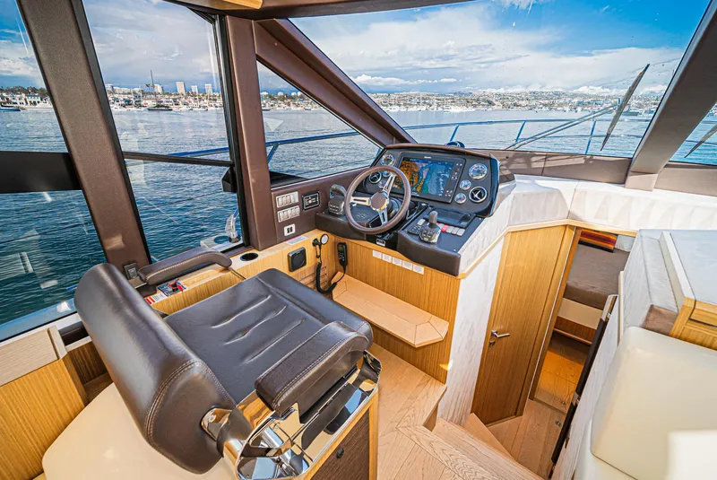 Slide: The Image of Interior helm of 2019 Absolute 45 FLY yacht with panoramic sea view. - 45