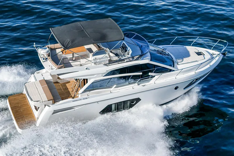 Slide: The Image of 2019 Absolute 45 FLY yacht cruising on open water. - 6