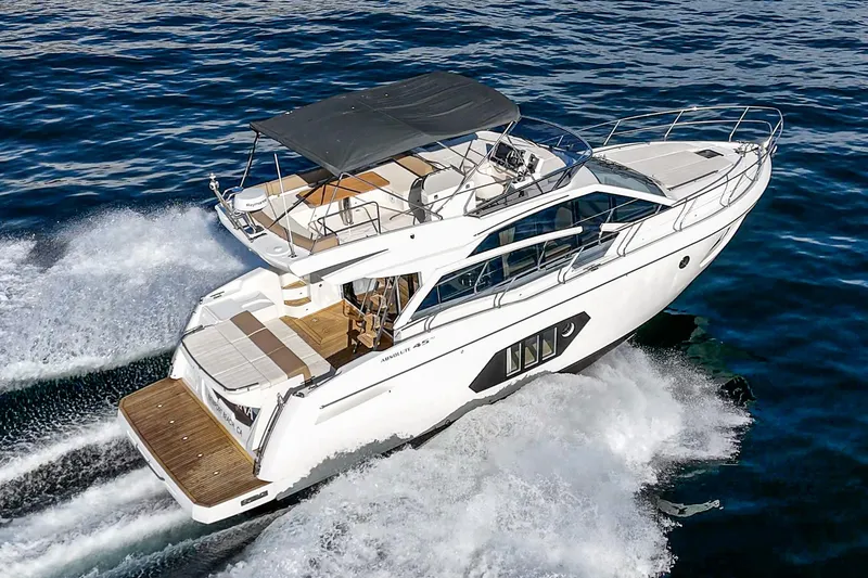 Slide: The Image of 2019 Absolute 45 FLY yacht cruising on open water, showcasing sleek design and luxury features. - 8