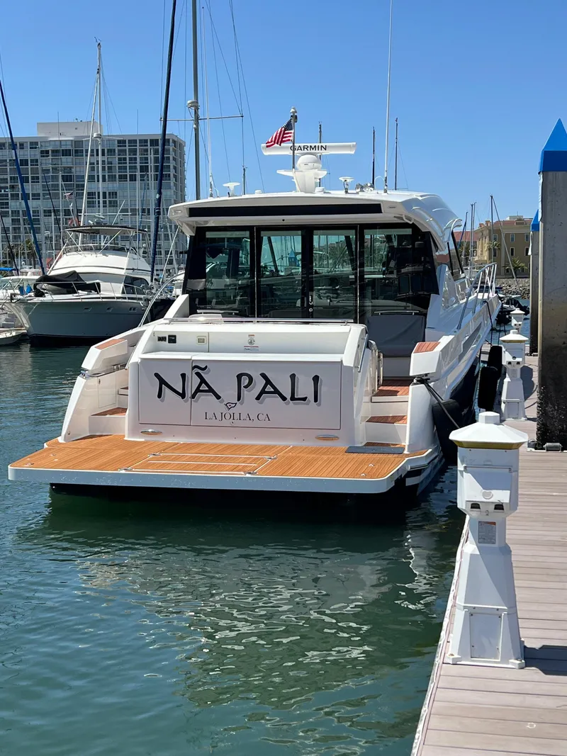Slide: The Image of 2021 Tiara Yachts 53 Coupe docked in marina, rear view. - 1