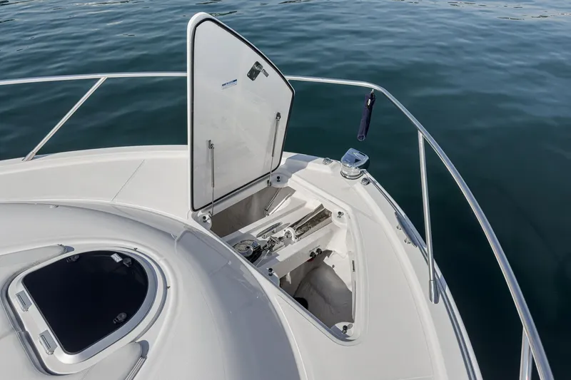 Slide: The Image of 2021 Tiara Yachts 53 Coupe bow with open hatch, showing anchor storage. - 23