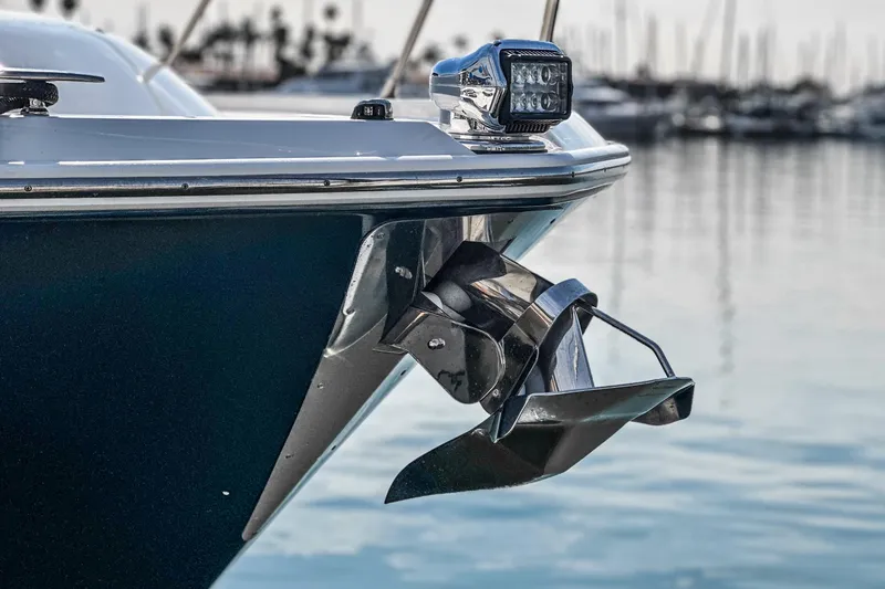 Slide: The Image of 2021 Tiara Yachts 53 Coupe bow with anchor, docked in marina. - 25