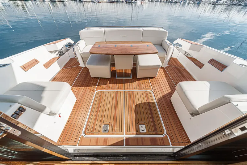 Slide: The Image of Luxurious 2021 Tiara Yachts 53 Coupe with elegant teak deck and spacious seating area. - 32