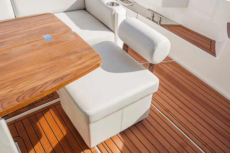 Slide: The Image of Luxury seating and wooden deck on 2021 Tiara Yachts 53 Coupe. - 34