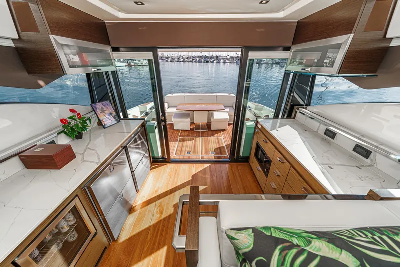 Slide: The Image of Luxurious interior of 2021 Tiara Yachts 53 Coupe with modern kitchen and waterfront view. - 39