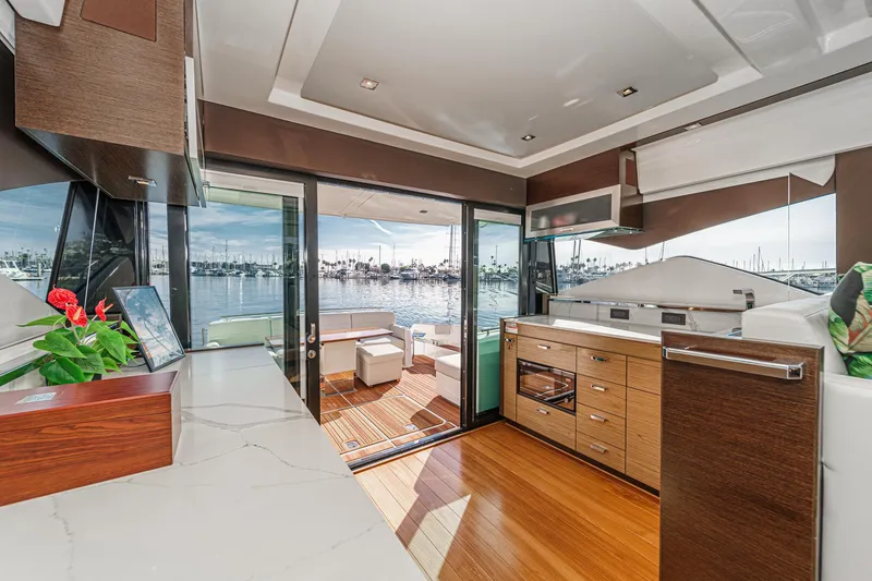 Slide: The Image of Luxurious interior of 2021 Tiara Yachts 53 Coupe with marina view. - 40
