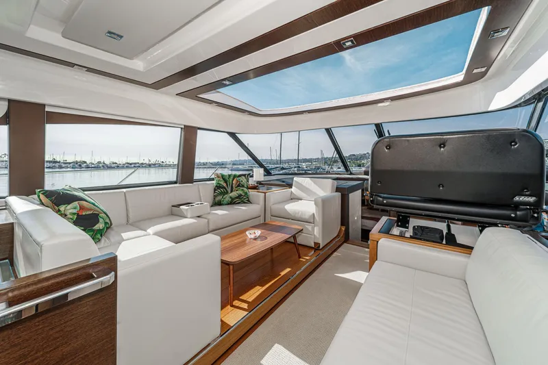 Slide: The Image of Luxurious interior of 2021 Tiara Yachts 53 Coupe with elegant seating and panoramic windows. - 48