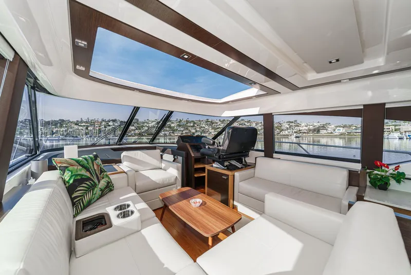 Slide: The Image of Luxurious interior of 2021 Tiara Yachts 53 Coupe with panoramic windows and modern furnishings. - 50