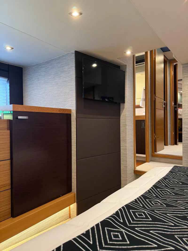 Slide: The Image of 2021 Tiara Yachts 53 Coupe interior cabin with modern design and wall-mounted TV. - 7