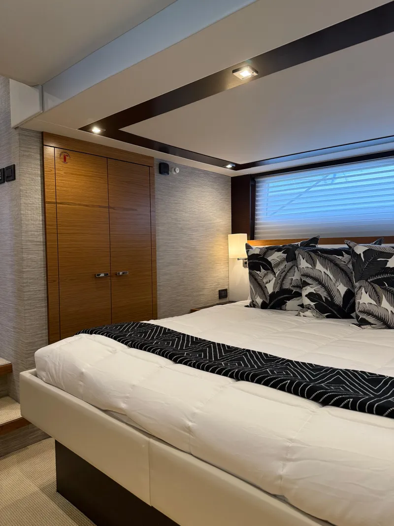 Slide: The Image of Luxurious bedroom interior of 2021 Tiara Yachts 53 Coupe with modern design and elegant decor. - 8