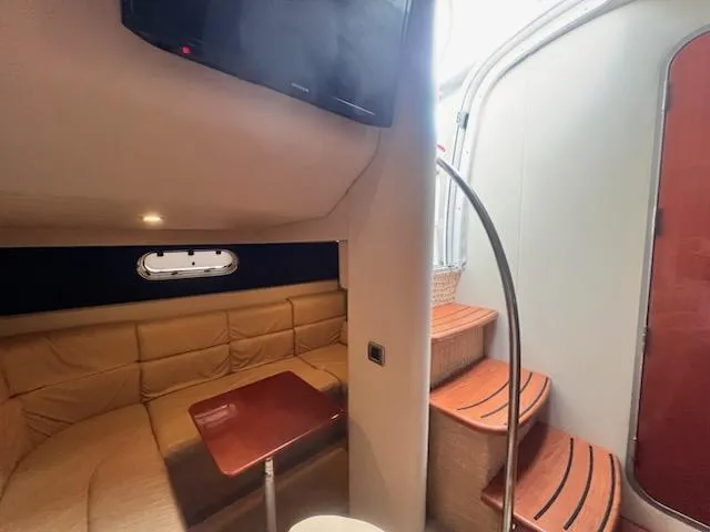 Slide: The Image of 2008 Formula 37 PC yacht interior with cozy seating and wooden steps. - 10