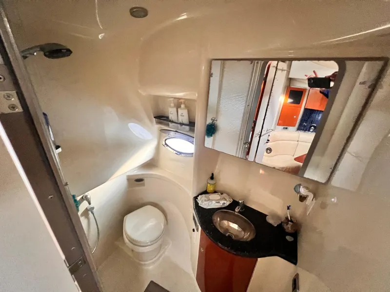 Slide: The Image of 2008 Formula 37 PC yacht bathroom with sink, toilet, and mirror. - 14