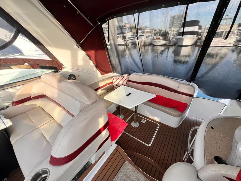 Slide: The Image of Luxurious 2008 Formula 37 PC yacht interior with plush seating and marina view. - 3