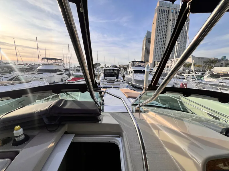 Slide: The Image of 2008 Formula 37 PC yacht docked at marina with city skyline in background. - 6