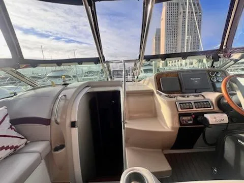 Slide: The Image of 2008 Formula 37 PC yacht cockpit with modern controls and city skyline view. - 7