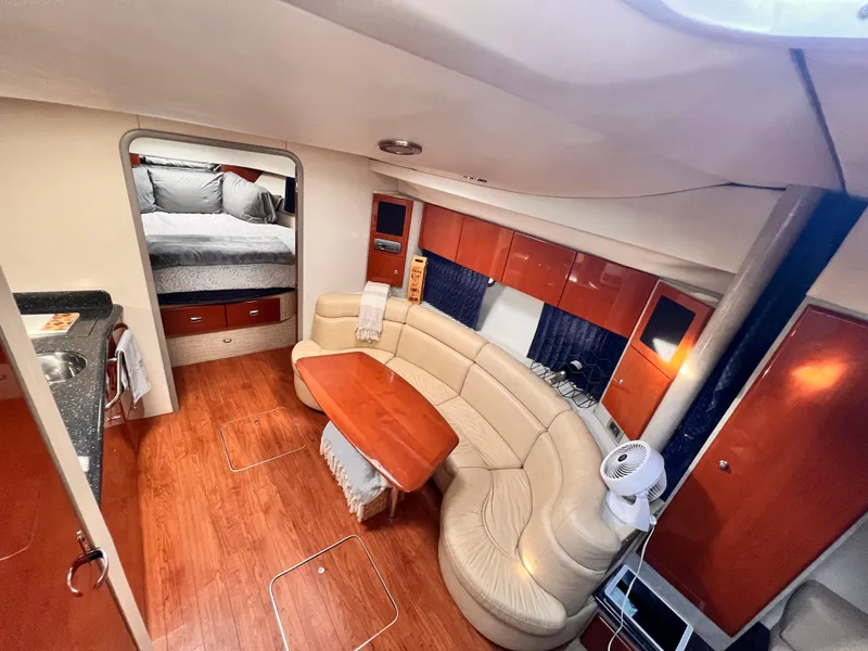 Slide: The Image of Luxurious interior of a 2008 Formula 37 PC yacht with elegant seating and wood finishes. - 8