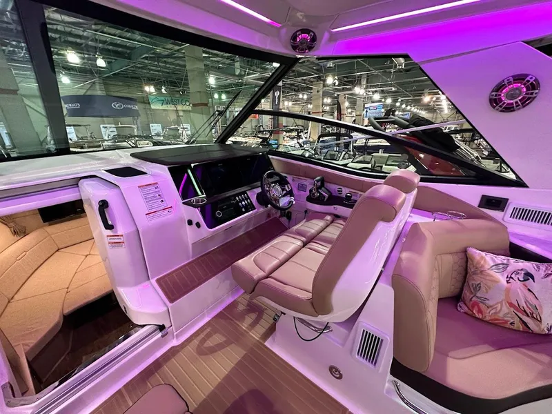 Slide: The Image of Interior of 2025 Sea Ray Sundancer 320 with modern helm and luxurious seating. - 12