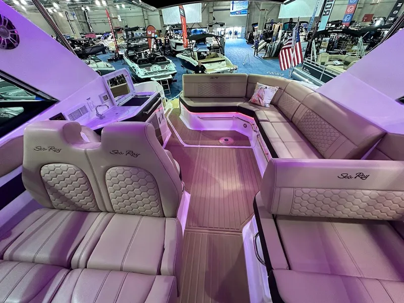 Slide: The Image of 2025 Sea Ray Sundancer 320 interior with luxurious seating and modern design. - 13