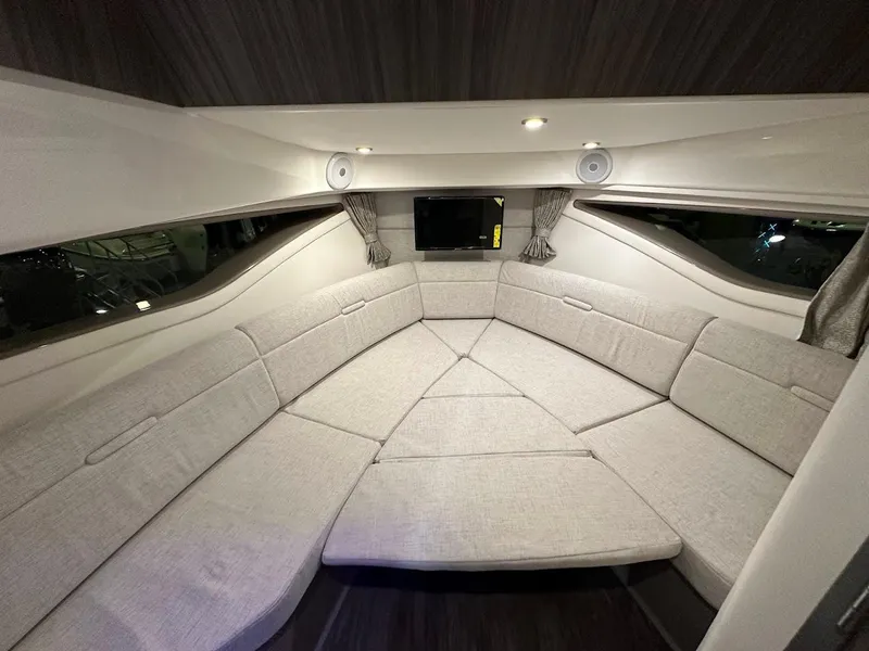 Slide: The Image of Interior of 2025 Sea Ray Sundancer 320, featuring a spacious, modern seating area. - 20