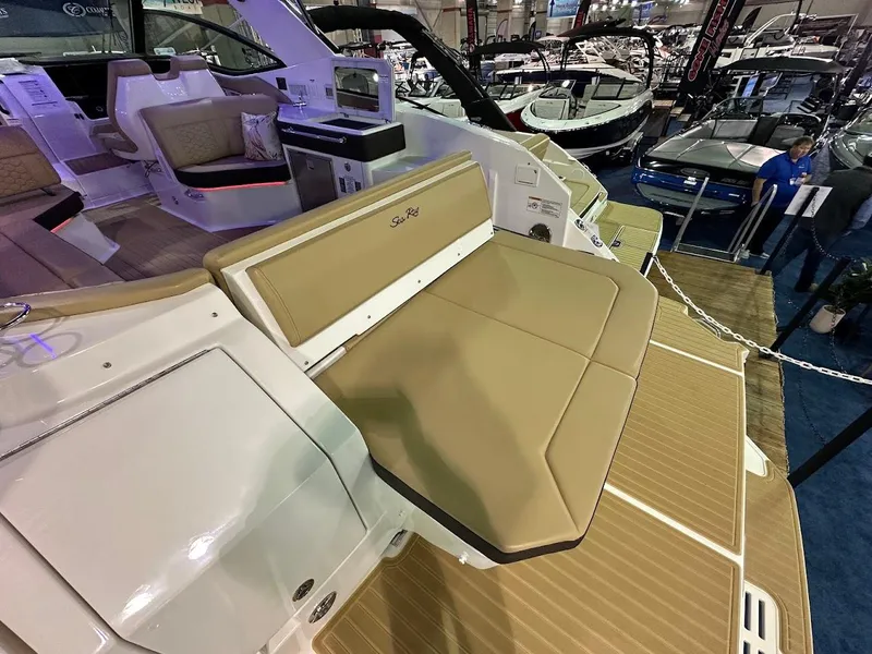 Slide: The Image of 2025 Sea Ray Sundancer 320 boat interior with tan seating and modern design. - 4