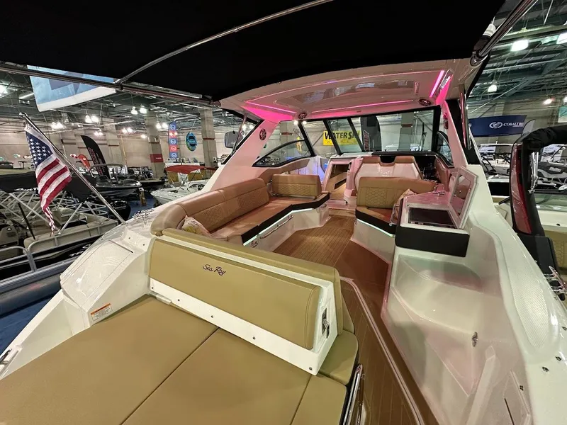 Slide: The Image of 2025 Sea Ray Sundancer 320 interior with luxurious seating and modern design. - 6