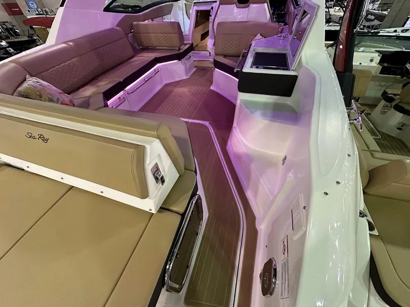 Slide: The Image of 2025 Sea Ray Sundancer 320 interior with luxurious seating and modern design. - 7