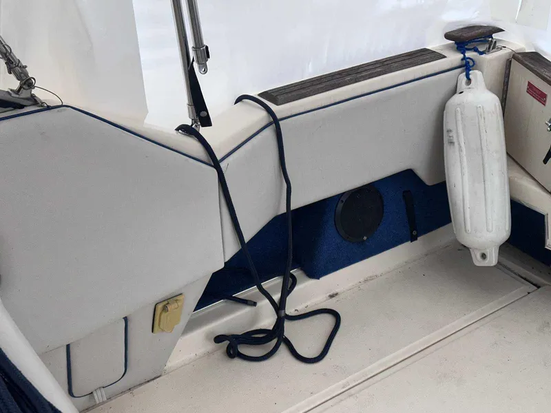 Slide: The Image of 1987 Sea Ray 270 Sundancer boat interior with fender and rope details. - 3