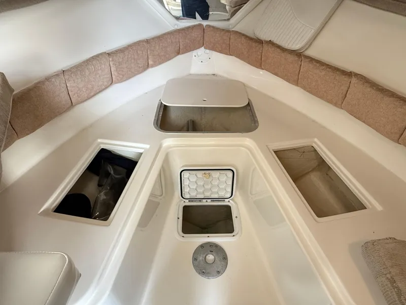 Slide: The Image of 2008 Seaswirl 2601 Walkaround I/O cabin interior with storage compartments and seating. - 15