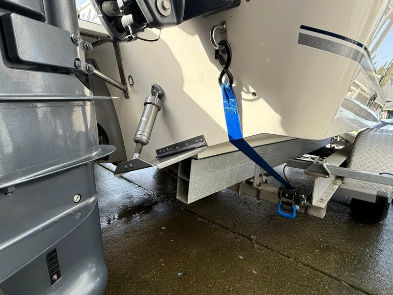 Slide: The Image of 2008 Seaswirl 2601 Walkaround I/O boat on trailer, secured with blue strap. - 21