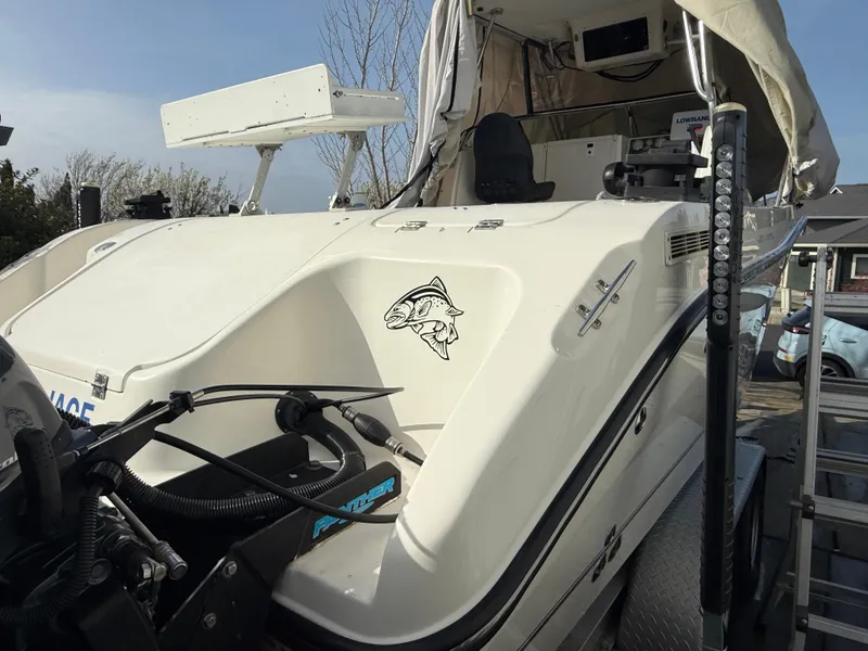 Slide: The Image of 2008 Seaswirl 2601 Walkaround I/O boat with fish decal, parked on trailer. - 22