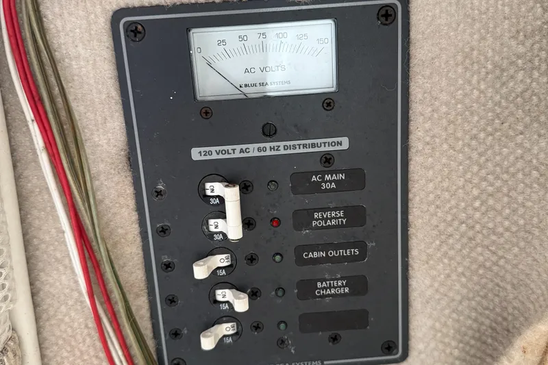 Slide: The Image of Electrical panel of 2008 Seaswirl 2601 Walkaround I/O with AC voltage meter and switches. - 23