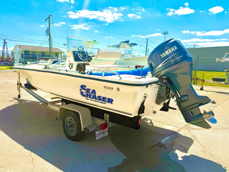 Slide: The Image of 2005 Sea Chaser 1950 RG boat with Yamaha outboard motor on a trailer. - 1