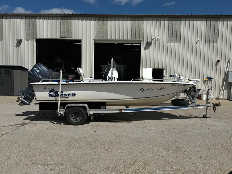 Slide: The Image of 2005 Sea Chaser 1950 RG boat on trailer outside a warehouse. - 10