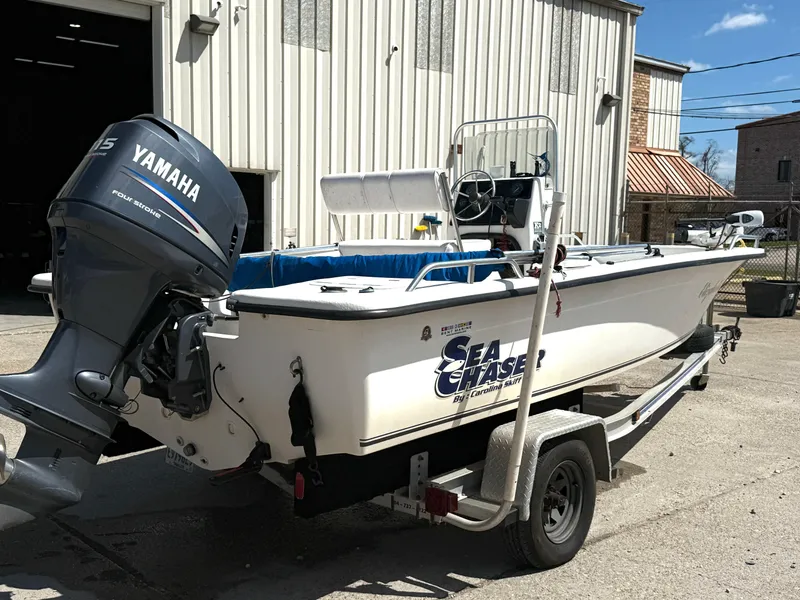 Slide: The Image of 2005 Sea Chaser 1950 RG boat with Yamaha outboard motor on a trailer. - 11