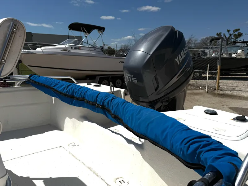 Slide: The Image of 2005 Sea Chaser 1950 RG boat with Yamaha 115 outboard motor, docked outdoors. - 3