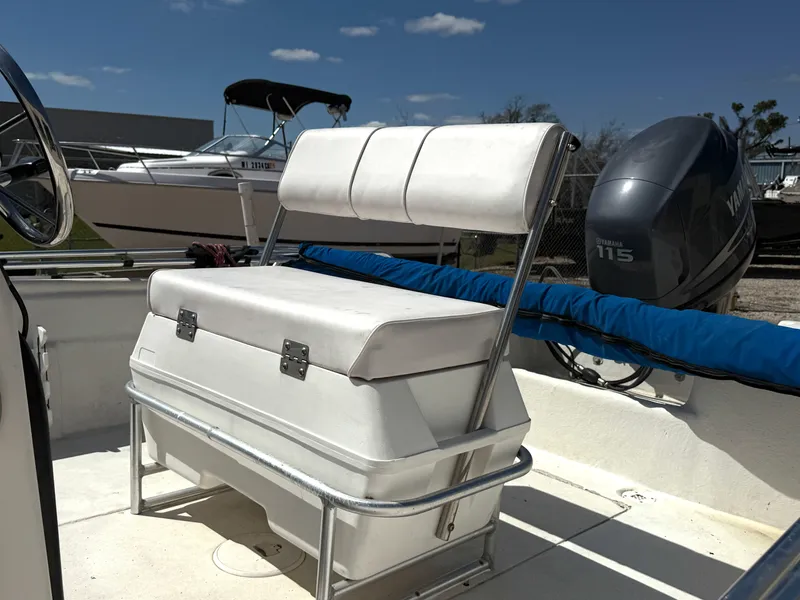 Slide: The Image of 2005 Sea Chaser 1950 RG boat interior with Yamaha 115 outboard motor. - 6