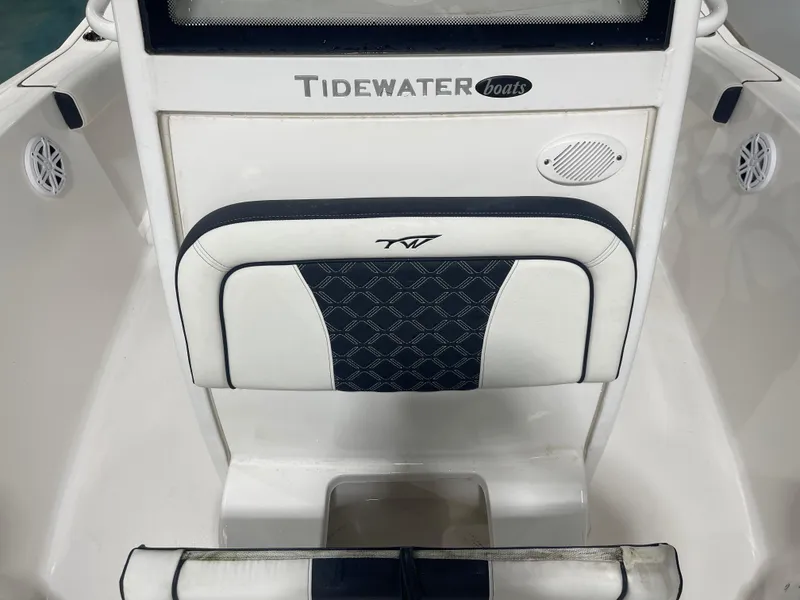 Slide: The Image of 2023 Tidewater 232cc boat interior with cushioned seating and speaker detail. - 24