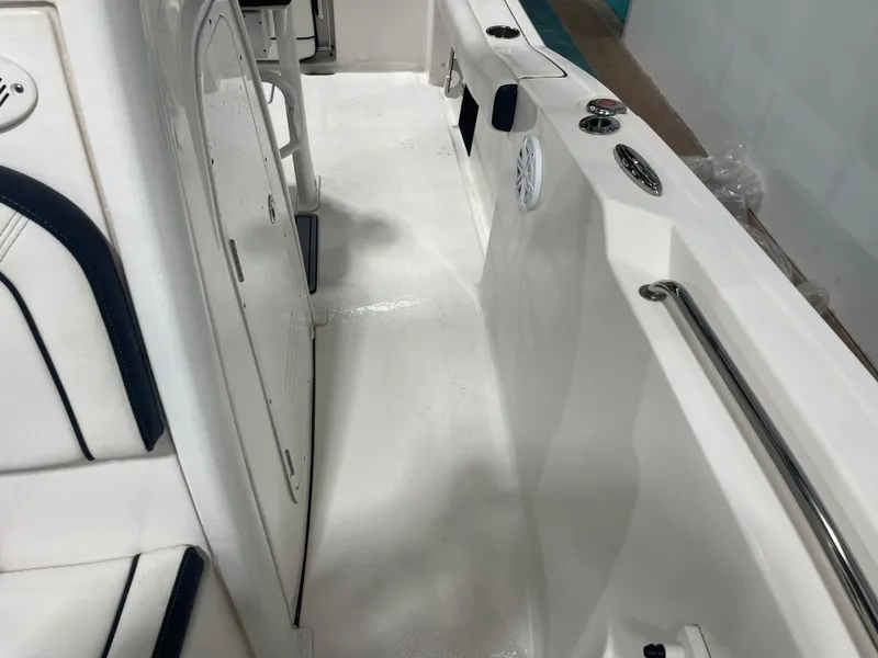 Slide: The Image of 2023 Tidewater 232cc boat interior, featuring sleek white design and modern amenities. - 28