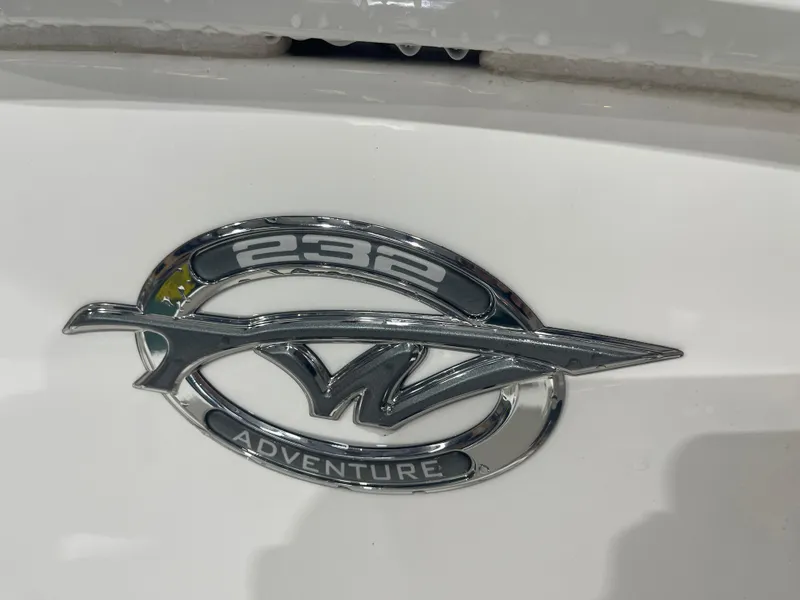 Slide: The Image of 2023 Tidewater 232cc Adventure boat emblem on white surface. - 32