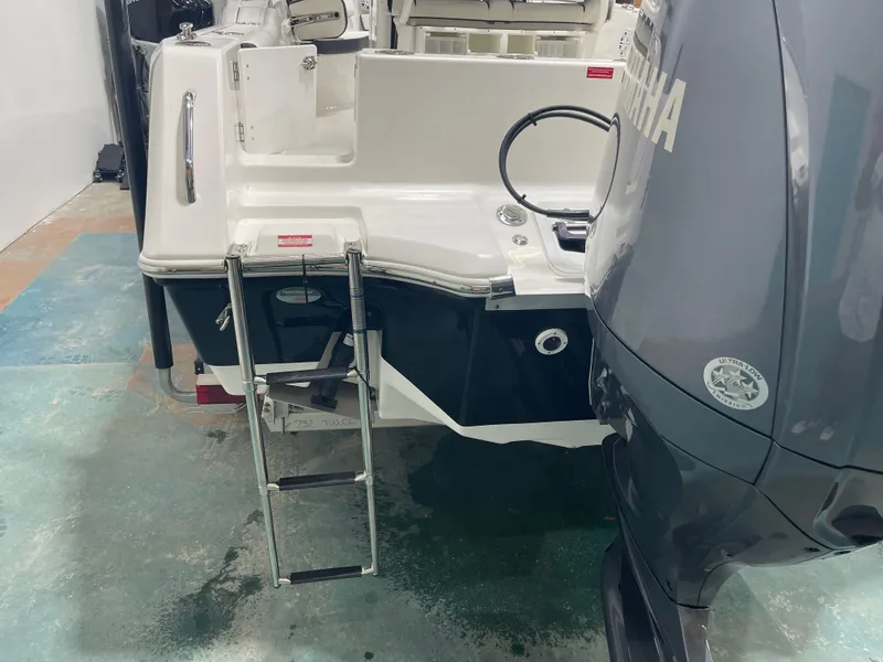 Slide: The Image of 2023 Tidewater 232cc boat with Yamaha engine and swim ladder. - 34