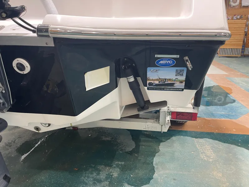 Slide: The Image of 2023 Tidewater 232cc boat rear view with trailer in showroom. - 36