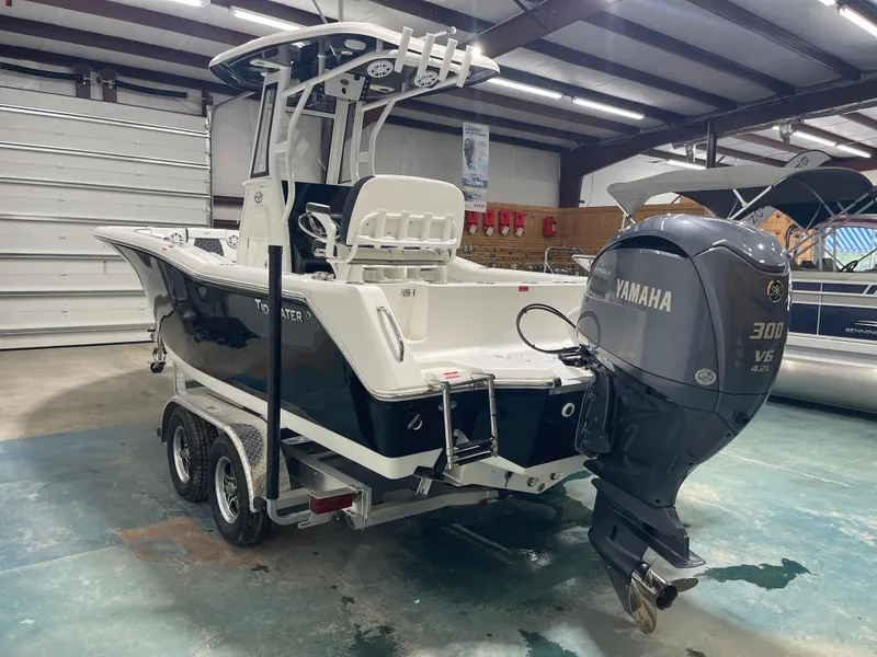 Slide: The Image of 2023 Tidewater 232cc boat with Yamaha 300 V6 engine in a showroom. - 7