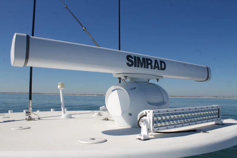 Slide: The Image of 2014 Yellowfin 32 Offshore boat with Simrad radar system on deck. - 19